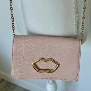 Betsy Johnson purse Pink Crossbody Bag with Gold Lip Detail.